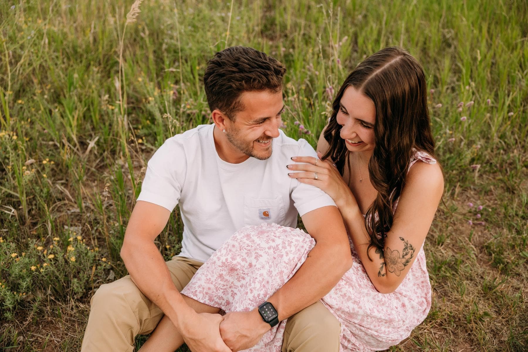 Couple embracing at sunset engagement photos Front Range Colorado