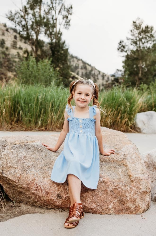 Kids running in field family session Severance Colorado