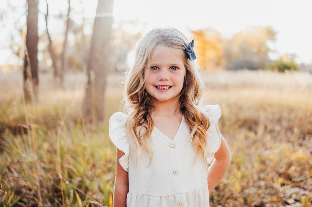 Kids running in field family session Severance Colorado