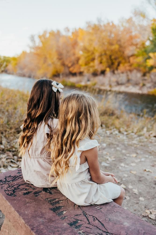 Kids running in field family session Severance Colorado