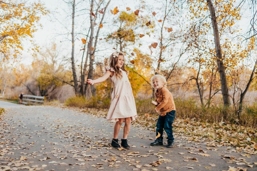 Family of four hugging outdoor portrait session Windsor Colorado