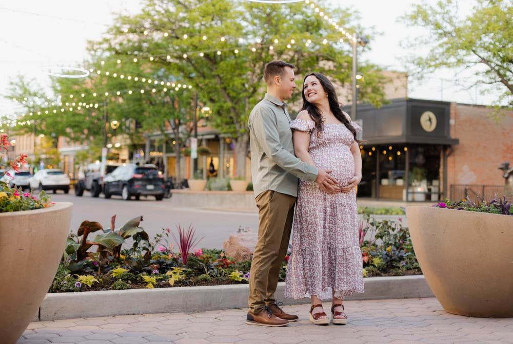Pregnant mother cradling bump outdoor maternity session Northern Colorado