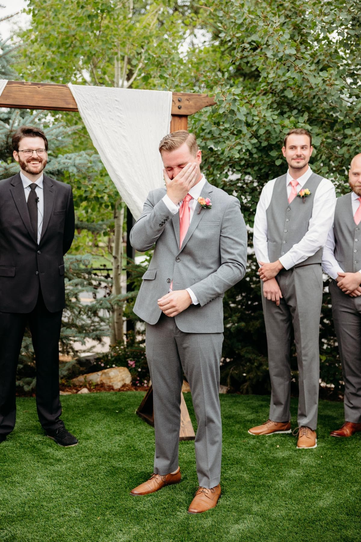 Bride walking down aisle surrounded by guests Northern Colorado wedding