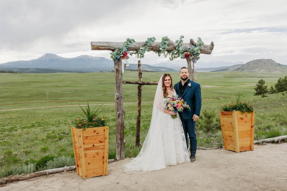 Bride walking down aisle surrounded by guests Northern Colorado wedding