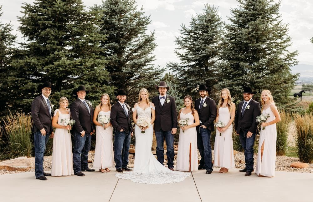 Bride walking down aisle surrounded by guests Northern Colorado wedding