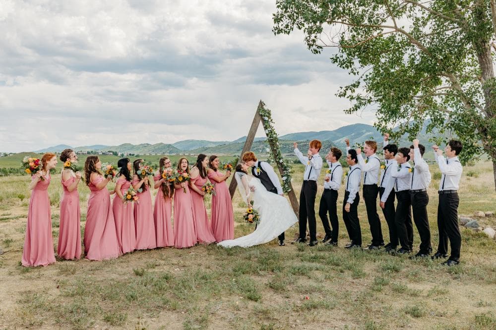 Bride walking down aisle surrounded by guests Northern Colorado wedding