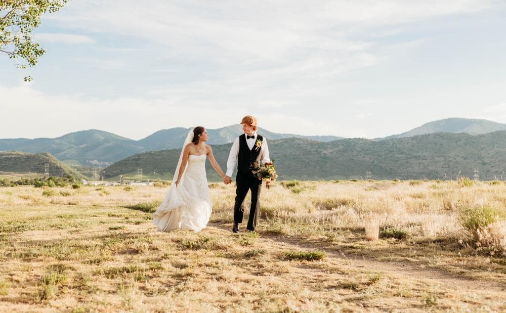 Bride walking down aisle surrounded by guests Northern Colorado wedding