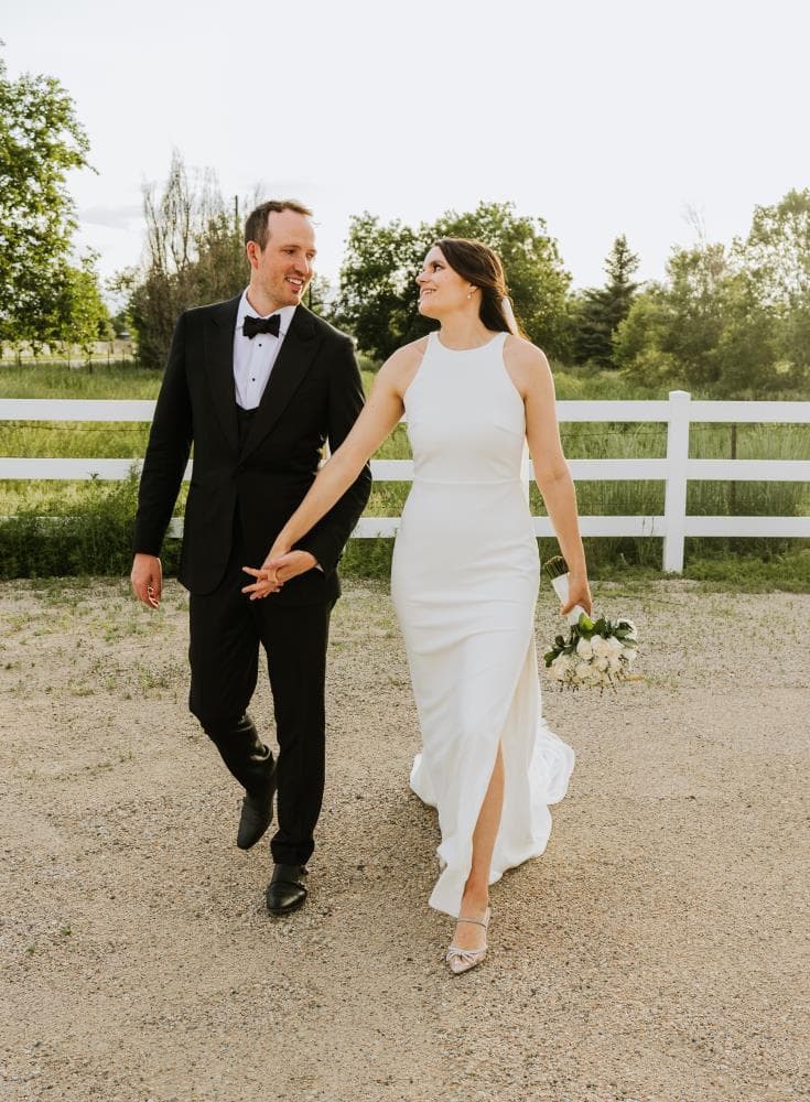 Bride walking down aisle surrounded by guests Northern Colorado wedding