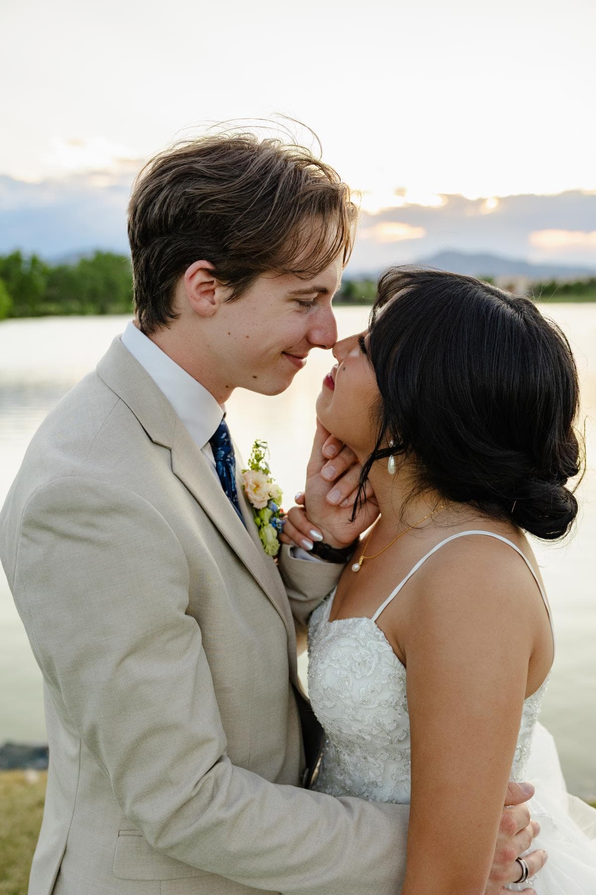 Newlyweds walking hand in hand at sunset Estes Park Colorado