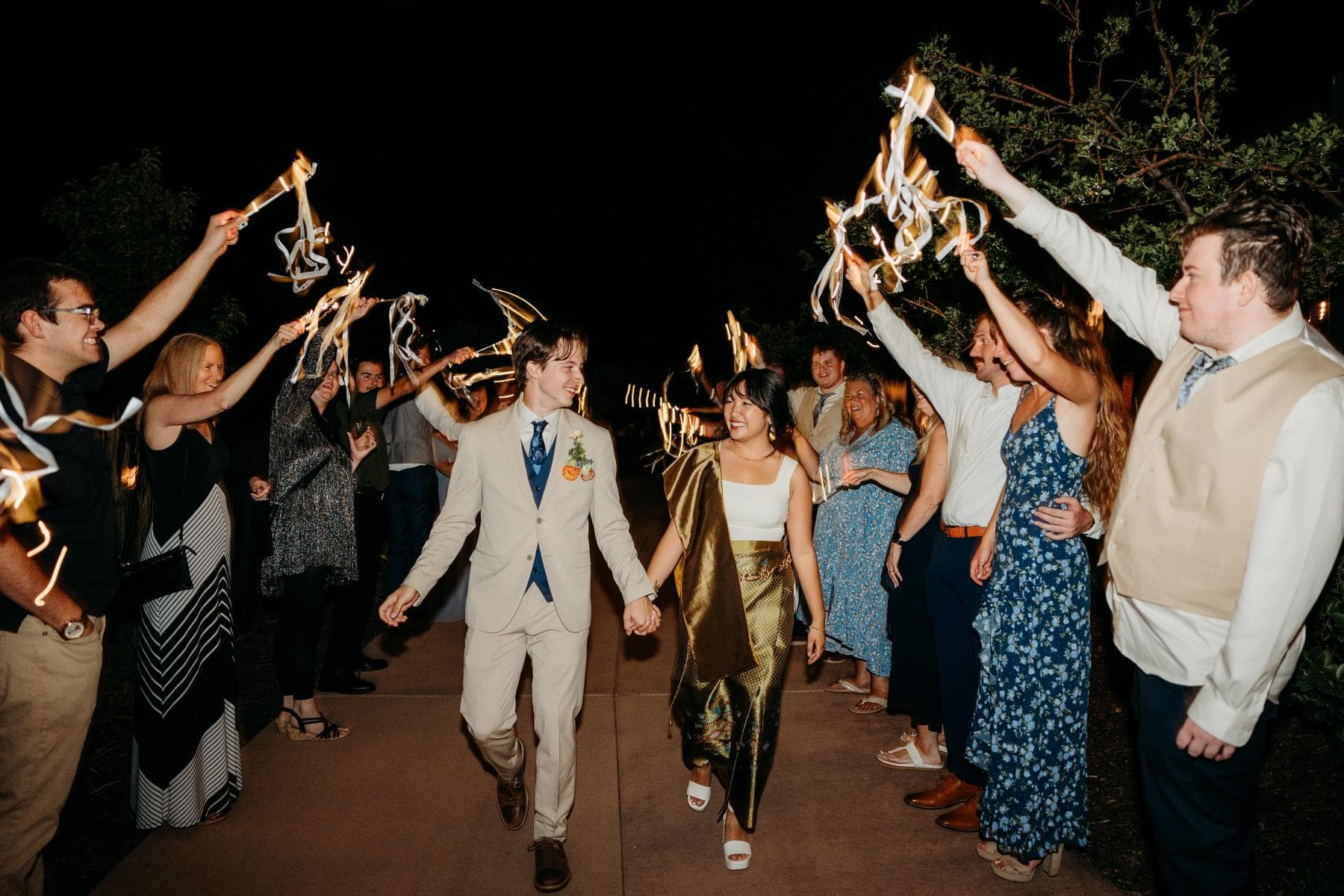 Bride walking down aisle surrounded by guests Northern Colorado wedding